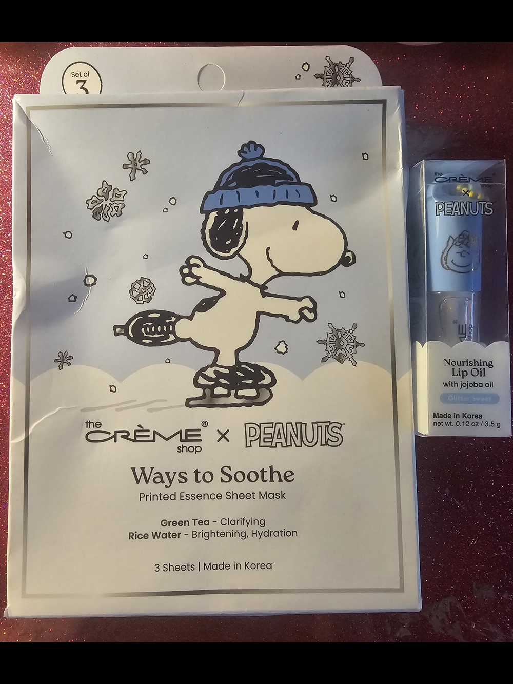 The Crème Shop x Peanuts Soothe Printed Essence Sheet Mask & Glitter Lip Oil